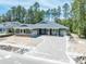 Charming single-story home with a paved driveway and two-car garage at 4729 Majestic Hills Loop, Brooksville, FL 34601