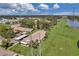 Aerial view of condo community near water, showcasing building exteriors and landscaping at 1308 13Th Se Cir, Largo, FL 33771