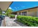 Exterior view of condo, showing manicured landscaping and covered parking at 1308 13Th Se Cir, Largo, FL 33771