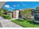 Condo exterior showcasing a private entrance and lush landscaping at 1308 13Th Se Cir, Largo, FL 33771