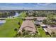 Condo building nestled in a landscape with a lake nearby at 1308 13Th Se Cir, Largo, FL 33771