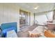 Spacious screened porch with seating area and access to the outdoors at 1308 13Th Se Cir, Largo, FL 33771