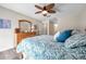 Bedroom with a queen bed, dresser, and ceiling fan at 1308 13Th Se Cir, Largo, FL 33771