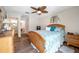 Spacious bedroom with a queen bed and view of the bathroom at 1308 13Th Se Cir, Largo, FL 33771