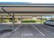 Designated parking spot under covered carport at 1308 13Th Se Cir, Largo, FL 33771