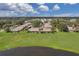 Expansive aerial view of condo community with lake access at 1308 13Th Se Cir, Largo, FL 33771