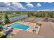Community pool and tennis courts with surrounding landscaping at 1308 13Th Se Cir, Largo, FL 33771