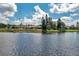 Community lake view with clubhouse and lush green landscape at 1308 13Th Se Cir, Largo, FL 33771