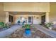 Inviting condo entryway with a screen door and patio seating at 1308 13Th Se Cir, Largo, FL 33771