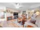 Living room with hardwood floors, fireplace, and comfy seating at 1308 13Th Se Cir, Largo, FL 33771