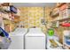 Functional laundry room, washer, dryer, and ample storage at 1308 13Th Se Cir, Largo, FL 33771