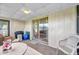 Bright screened porch, sliding door access, and outdoor view at 1308 13Th Se Cir, Largo, FL 33771