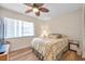 Cozy bedroom with a double bed and a ceiling fan at 1308 13Th Se Cir, Largo, FL 33771