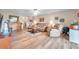 Living room with hardwood floors, comfy seating, and a piano at 1308 13Th Se Cir, Largo, FL 33771