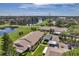 Condo building with carport and serene lake view at 1308 13Th Se Cir, Largo, FL 33771