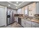 Modern kitchen with stainless steel appliances and granite countertops at 50 Coe Rd # 322, Belleair, FL 33756