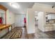 Bright and airy entryway with tile floors and access to kitchen at 50 Coe Rd # 322, Belleair, FL 33756