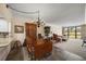Charming dining area with wood table and chandelier, overlooking golf course at 50 Coe Rd # 322, Belleair, FL 33756