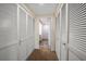 Hallway with multiple closets and carpet at 50 Coe Rd # 322, Belleair, FL 33756