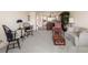 Open living room showcasing ample natural light and comfortable furniture at 50 Coe Rd # 322, Belleair, FL 33756