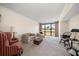 Spacious living room with golf course view and comfortable seating at 50 Coe Rd # 322, Belleair, FL 33756