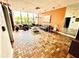 Spacious living room with hardwood floors and large windows at 255 Dolphin Pt # 909, Clearwater, FL 33767