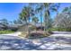 Front exterior showcasing a charming house with palm trees at 5333 Cobblestone Ct, Wesley Chapel, FL 33543