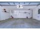 Attached garage with ample storage shelving and space at 5333 Cobblestone Ct, Wesley Chapel, FL 33543