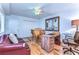 Bright home office features wood floors, built-in desk, and comfortable seating at 5333 Cobblestone Ct, Wesley Chapel, FL 33543