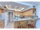 Kitchen with light wood cabinets and a breakfast bar at 5333 Cobblestone Ct, Wesley Chapel, FL 33543