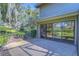Spacious patio with sliding glass doors and lush landscaping at 5333 Cobblestone Ct, Wesley Chapel, FL 33543
