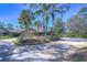Two-story home with driveway and mature landscaping at 5333 Cobblestone Ct, Wesley Chapel, FL 33543