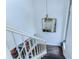 View of a staircase with white railings and dark wood flooring at 5333 Cobblestone Ct, Wesley Chapel, FL 33543