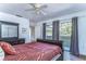 Bedroom with a dark wood sleigh bed and access to balcony at 5333 Cobblestone Ct, Wesley Chapel, FL 33543
