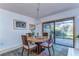 Charming dining room features a round table, four chairs, and access to a private patio at 5333 Cobblestone Ct, Wesley Chapel, FL 33543