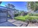 Screened patio with view of the lush green backyard at 5333 Cobblestone Ct, Wesley Chapel, FL 33543