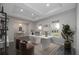 Bright home office features hardwood floors, built-in shelving, and a large window at 4729 Majestic Hills Loop, Brooksville, FL 34601