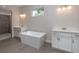 Bathroom with soaking tub, double vanity, and modern finishes at 4729 Majestic Hills Loop, Brooksville, FL 34601