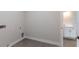 Convenient laundry room with tile flooring and access to a half bathroom at 4729 Majestic Hills Loop, Brooksville, FL 34601