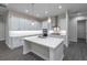 Kitchen island with white cabinets and quartz countertops at 4729 Majestic Hills Loop, Brooksville, FL 34601