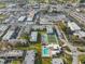 Aerial view of apartment community with pool and tennis court at 7701 Starkey Rd # 322, Seminole, FL 33777