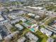 Aerial view of apartment community with pool and tennis court at 7701 Starkey Rd # 322, Seminole, FL 33777