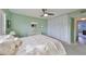 Bedroom with double closets and a ceiling fan at 7701 Starkey Rd # 322, Seminole, FL 33777