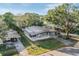 Aerial view of a single story home with a large yard at 5139 Hill Dr, Zephyrhills, FL 33542