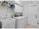 Laundry room with washer, dryer, and utility sink at 775 Brittany Park Blvd, Tarpon Springs, FL 34689