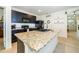 Kitchen featuring a granite island, modern appliances, and ample countertop space at 1523 Glen Grove Loop, Wesley Chapel, FL 33543