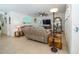 Comfortable living room with tile floors, ceiling fan, TV, and unique décor, perfect for relaxing or entertaining at 1523 Glen Grove Loop, Wesley Chapel, FL 33543