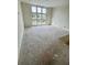 Unfinished bedroom featuring a large window with a view to the outside at 3403 W Leona St, Tampa, FL 33629