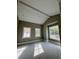 Bedroom boasting vaulted ceiling, neutral colors, and large windows for natural light at 3403 W Leona St, Tampa, FL 33629