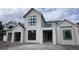 New two-story home with a three car garage and a charming stone walkway on a partially landscaped lot at 3403 W Leona St, Tampa, FL 33629